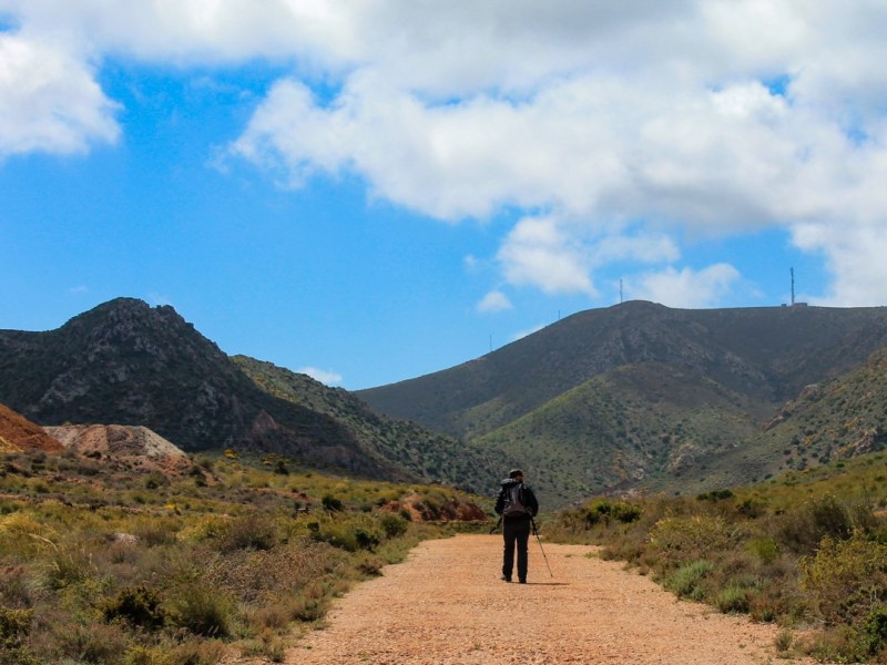 A dusty red road through the&nbsp;hills