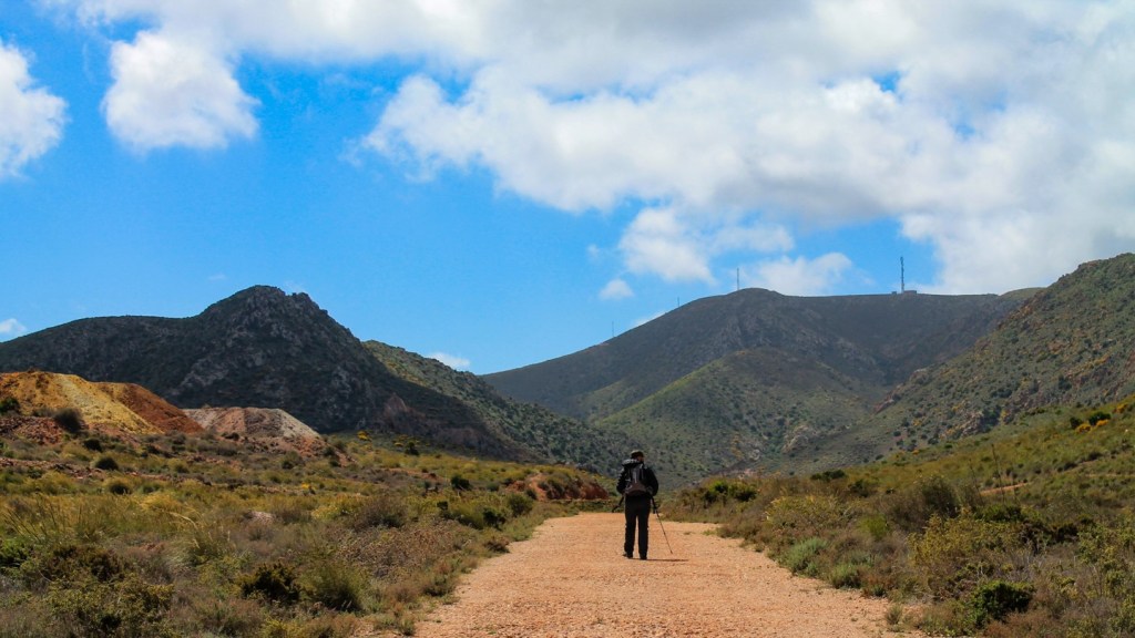 A dusty red road through the&nbsp;hills